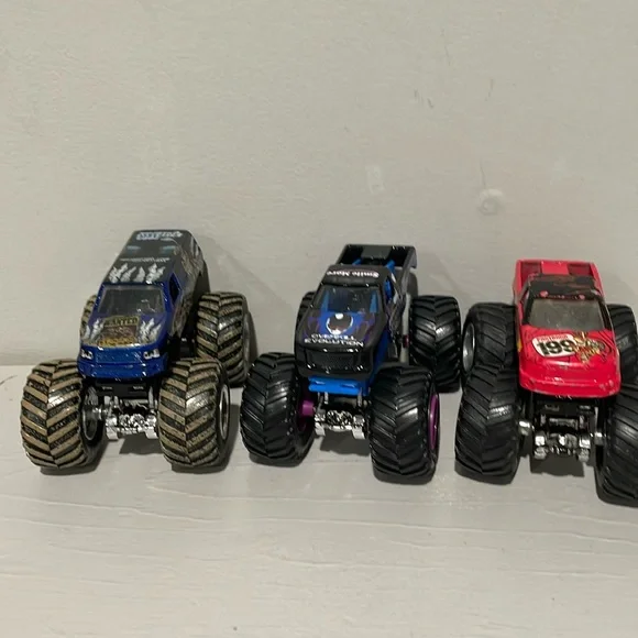 Monster Jam Trucks 1:64 Bounty Hunter, Overall Evolution and HotWheels 199 - Picture 1 of 4